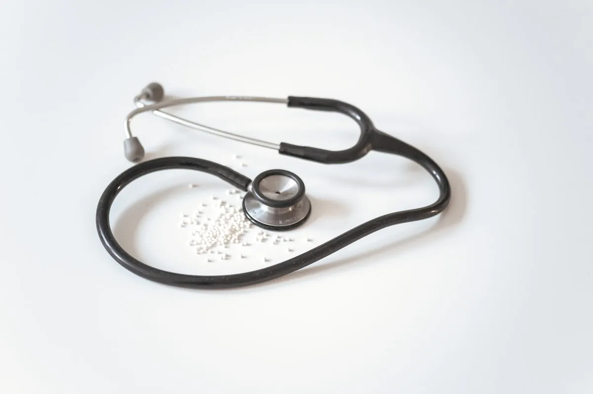 Healthcare provider checking patient record on a tablet
